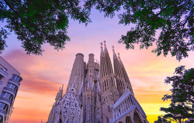 Low angle view of buildings against sky during sunset