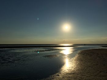 Scenic view of sea against sky at sunset