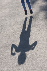 Low section of person standing on street