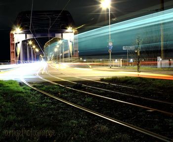 Light trails on railroad track at night