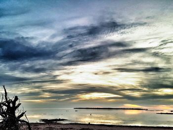 Scenic view of sea against cloudy sky