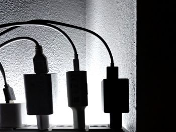 Close-up of electric lamp on wall