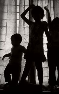 Shadow of children on statue
