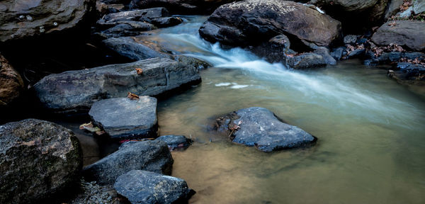 Scenic view of waterfall in river