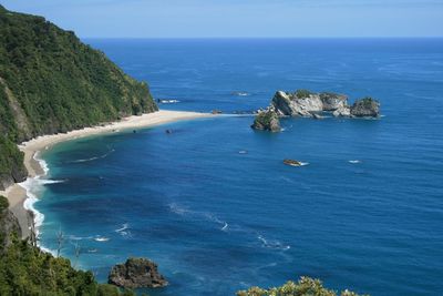 High angle view of sea against blue sky