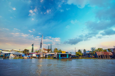 Pier over river against sky