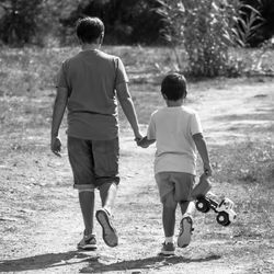 Rear view of friends walking