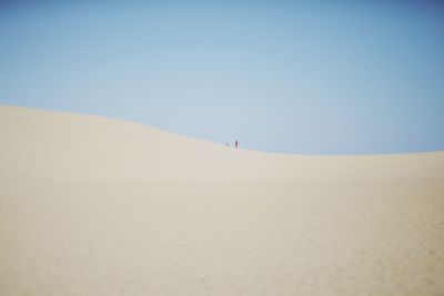 Scenic view of desert against clear sky