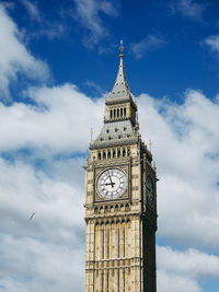 Low angle view of clock tower against sky