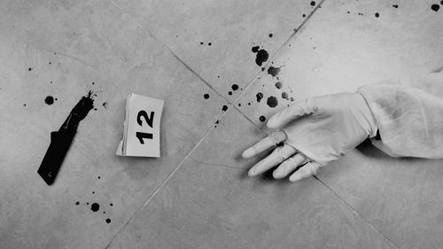 High angle view of hand at crime scene