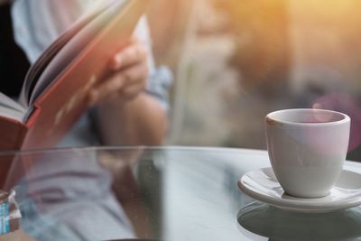 Close-up of coffee served on table at cafe