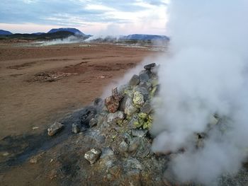 Smoke emitting from volcanic landscape