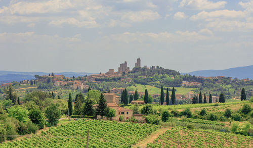 Scenic view of landscape against sky at san gimignano in tuscany in summer