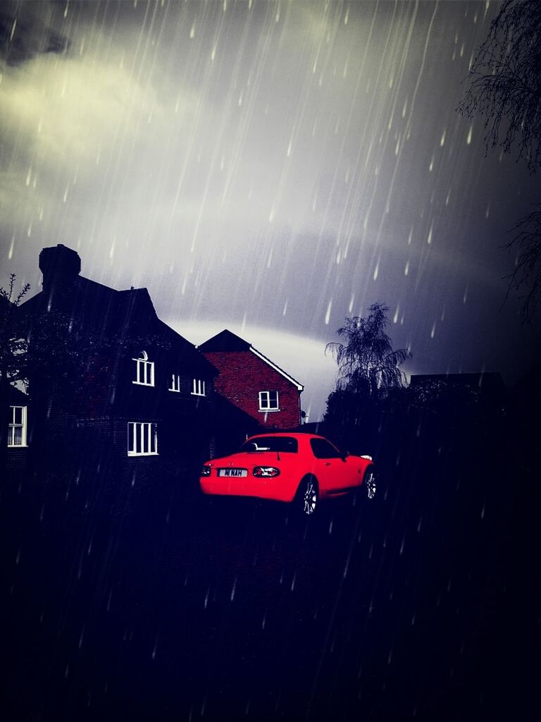 night, illuminated, sky, building exterior, built structure, architecture, house, long exposure, dark, street, car, rainbow, outdoors, residential structure, motion, cloud - sky, no people, light - natural phenomenon, city, lightning