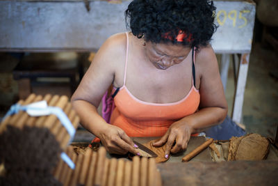 Midsection of woman working at table