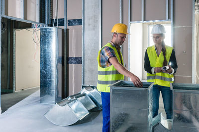 Man and woman working in office