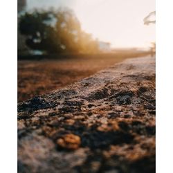 Surface level of road on field against sky