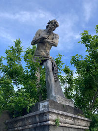 Low angle view of statue against sky