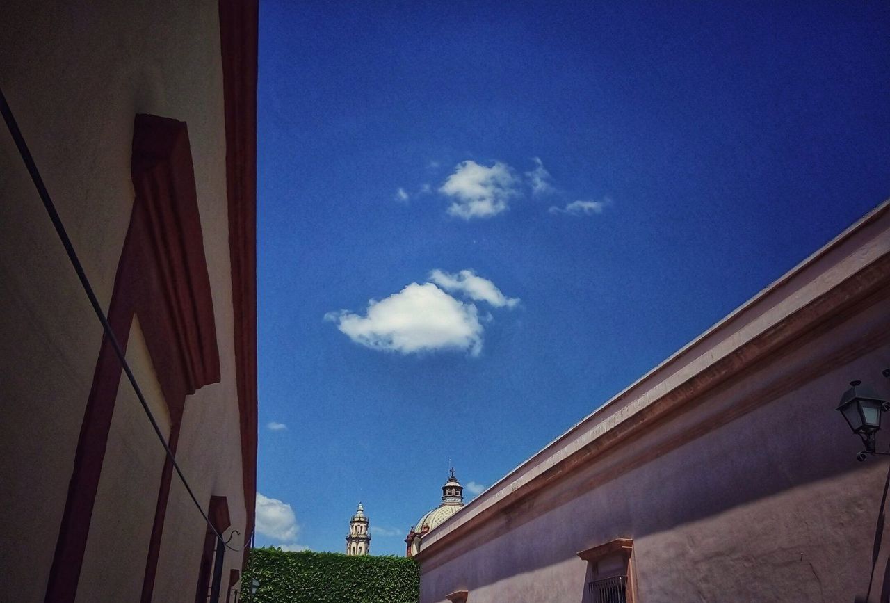 building exterior, architecture, sky, built structure, cloud - sky, building, blue, low angle view, no people, day, nature, outdoors, city, residential district, window, industry, glass - material, factory, house, wall - building feature