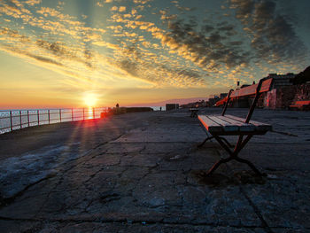 Scenic view of beach against sky during sunset