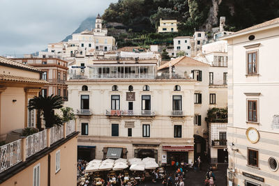 Buildings in town against sky