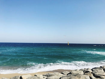 Scenic view of sea against clear sky