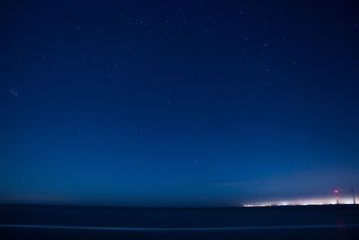 Scenic view of sea against sky at night