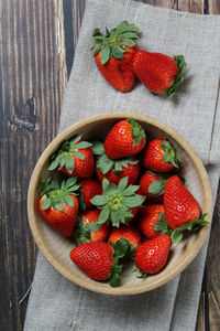 High angle view of strawberries in bowl on table