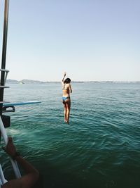 Woman standing on beach