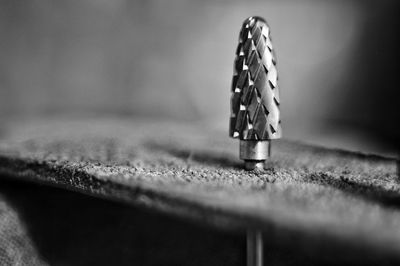 Close-up of drill bit on table