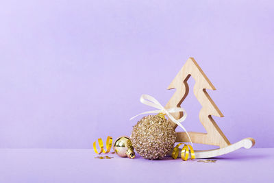 Close-up of christmas decoration against gray background