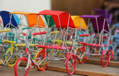 Colorful rickshaw toys for sale at market