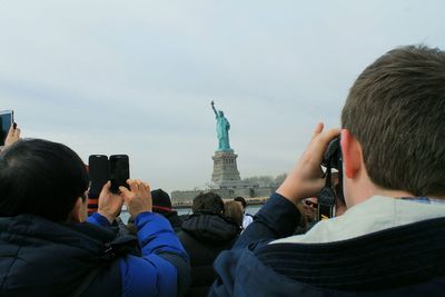 Silhouette of person standing in front of eiffel tower