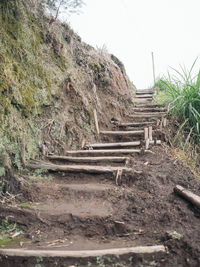 Steps on landscape against clear sky