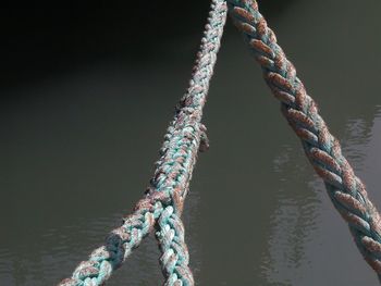 Close-up of ropes tied up on rope