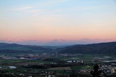 Scenic view of mountains against sky at sunset
