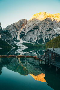 Scenic view of lake and snowcapped mountains against sky