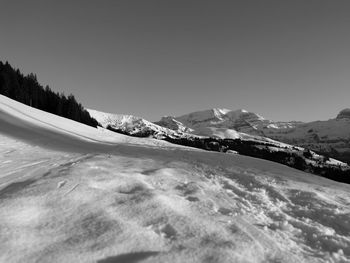 Scenic view of snow mountains against clear sky