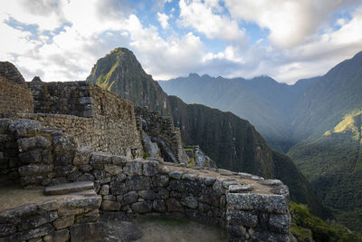 Ruins of building against cloudy sky