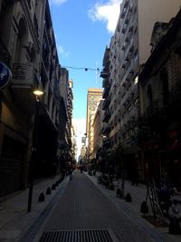 Alley amidst buildings in city