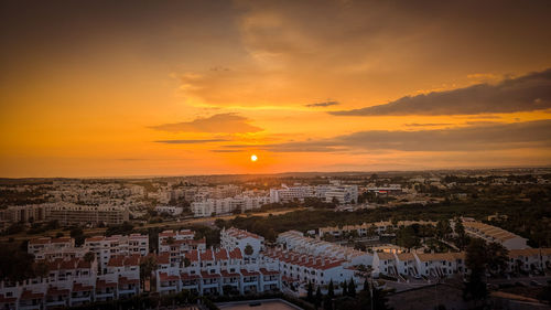 High angle view of townscape against sky during sunset