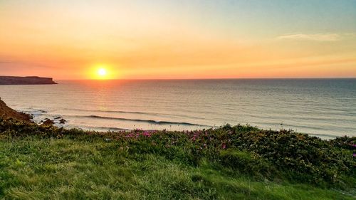 Scenic view of sea against sky during sunset