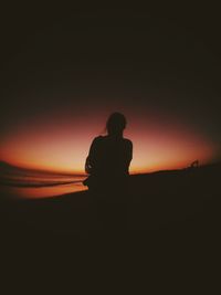 Silhouette man against sky at night