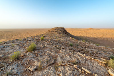 Scenic view of land against clear sky