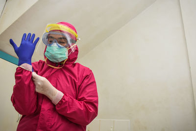 Portrait of doctor wearing mask and protection suits