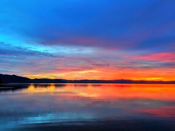 Scenic view of sea against romantic sky at sunset