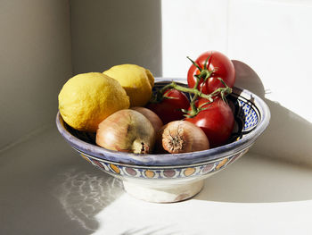 Close-up of fruits in bowl on table