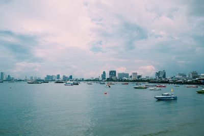 Scenic view of sea and buildings against sky