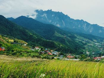 Scenic view of landscape and mountains against sky