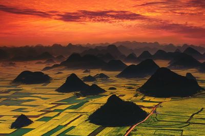 Scenic view of landscape against sky during sunset